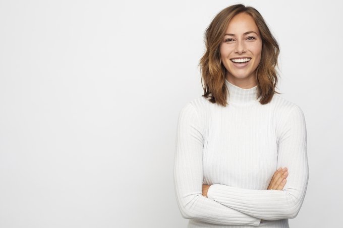 woman headshot Smiling woman in a white sweater